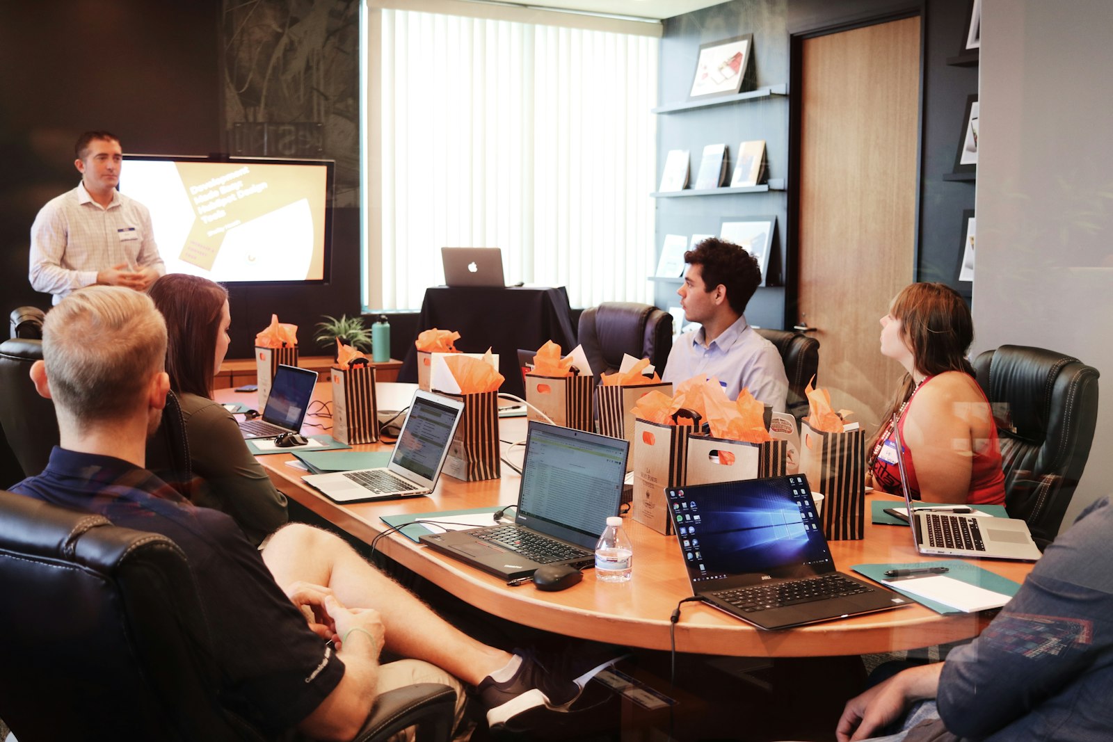 A team in a conference room reviewing a campaign presentation